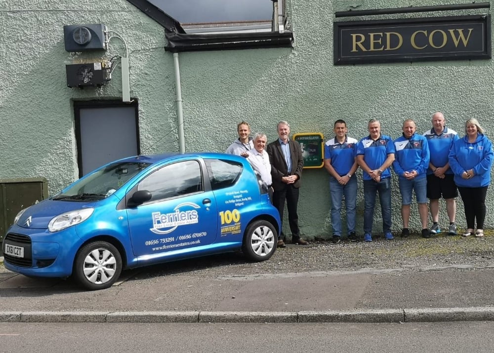 Ferriers Managing Director Mr Brian Thomas along side Chris Morgan, Huw Irranca Davies MP and a few of the Maesteg Park F.C management team at the unveiling of the de-fibrulator at the Red Cow public house.